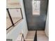 Modern staircase with metal railing and geometric ceiling detail at 3059 Bold Springs Rd, Dacula, GA 30019