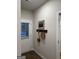 Inviting entryway with coat rack, decorative art, and door with window at 253 Ivey Ter # 48, Temple, GA 30179