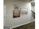 Hallway featuring decorative artwork and staircase at 253 Ivey Ter # 48, Temple, GA 30179