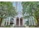 Building entrance featuring large doors, manicured landscaping, and a welcoming stairway at 2870 Pharr Court South Nw Ct # 2703, Atlanta, GA 30305