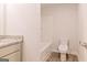 Bright bathroom with granite counters, a shower-tub combo, modern toilet, and wood-look floors at 180 Weldon Rd # 21, Mcdonough, GA 30253
