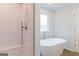 Elegant bathroom featuring a shower, soaking tub and white subway tile at 180 Weldon Rd # 21, Mcdonough, GA 30253