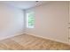 Bright bedroom with a neutral carpet and a window at 180 Weldon Rd # 21, Mcdonough, GA 30253