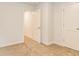 Carpeted bedroom featuring an open door and closet door at 180 Weldon Rd # 21, Mcdonough, GA 30253