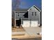 Two-story home with a gray exterior, white trim, two-car garage and modern design elements at 180 Weldon Rd # 21, Mcdonough, GA 30253