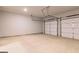 Spacious garage with two-car capacity and neutral walls at 180 Weldon Rd # 21, Mcdonough, GA 30253