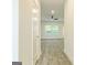 Hallway leading to an open-concept living space with wood-look floors at 180 Weldon Rd # 21, Mcdonough, GA 30253