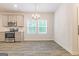 Kitchen and dining area with stainless steel appliances at 180 Weldon Rd # 21, Mcdonough, GA 30253
