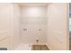 Laundry room with white walls, utility connections, and wood floors at 180 Weldon Rd # 21, Mcdonough, GA 30253