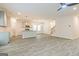 Open concept living area showcasing gray plank floors and natural light at 180 Weldon Rd # 21, Mcdonough, GA 30253