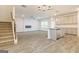 Open-concept living space with modern fireplace and kitchen island at 180 Weldon Rd # 21, Mcdonough, GA 30253