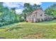 House with a large backyard and trees at 212 Sims St, Palmetto, GA 30268