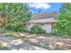 Ranch style home with awning and landscaped yard at 212 Sims St, Palmetto, GA 30268