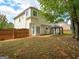 Back yard view featuring the home and an entertainment area at 2560 Almont Way, Roswell, GA 30076