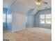 Finished carpeted bonus room with dormered walls, carpet and natural light at 2560 Almont Way, Roswell, GA 30076