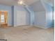Carpeted bonus room has dormered walls, carpet and a hallway entrance at 2560 Almont Way, Roswell, GA 30076