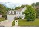 Charming two-story home with a well-manicured lawn and a two car garage at 2560 Almont Way, Roswell, GA 30076