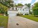 Charming two-story home with manicured lawn and attached two-car garage at 2560 Almont Way, Roswell, GA 30076