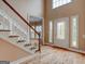 Elegant foyer features hardwood floors, staircase, and a decorative glass front door at 2560 Almont Way, Roswell, GA 30076