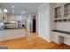This open kitchen design includes hardwood floors, granite counters, stainless appliances and a built-in desk at 2560 Almont Way, Roswell, GA 30076