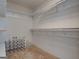 Walk-in closet featuring built-in shelving for optimal storage space at 2560 Almont Way, Roswell, GA 30076