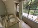 Bathroom with double vanity, large window, and access to a patio at 435 Ridgedale Way, Lawrenceville, GA 30044