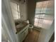 Bathroom with granite vanity and window overlooking deck at 435 Ridgedale Way, Lawrenceville, GA 30044