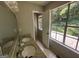 Bathroom with double vanity, large window, and access to a patio at 435 Ridgedale Way, Lawrenceville, GA 30044