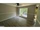 Bright bedroom with vinyl flooring and a large window at 435 Ridgedale Way, Lawrenceville, GA 30044