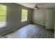 Bright bedroom featuring hardwood floors and ceiling fan at 435 Ridgedale Way, Lawrenceville, GA 30044
