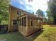 Back exterior view showing two-story home with screened porch at 435 Ridgedale Way, Lawrenceville, GA 30044