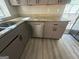 Kitchen corner with granite countertop and stainless steel dishwasher at 435 Ridgedale Way, Lawrenceville, GA 30044