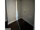 Small laundry area with dark hardwood floors at 90 Austin Dr, Mcdonough, GA 30252