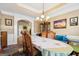 Formal dining room with elegant table and chandelier at 348 Relative Trl, Mcdonough, GA 30253