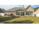 Rear view of house with sunroom and patio at 348 Relative Trl, Mcdonough, GA 30253