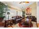 Living room with leather sofas, wood coffee table, and large windows at 348 Relative Trl, Mcdonough, GA 30253