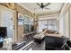 Relaxing sunroom with seating area and ceiling fan at 348 Relative Trl, Mcdonough, GA 30253