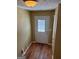 Light and airy entryway with wood-look flooring at 4403 Pinscher St, Union City, GA 30291