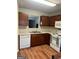 Galley kitchen with wood cabinets and appliances at 4403 Pinscher St, Union City, GA 30291