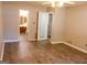 Bedroom featuring wood-look flooring and connections to an en-suite bathroom at 2884 Mountbery Dr, Snellville, GA 30039