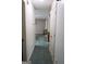 Hallway featuring decorative floor tiles and wall accents leading to interior rooms at 2884 Mountbery Dr, Snellville, GA 30039