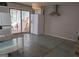 Bright kitchen with tile flooring, white appliances and breakfast nook overlooking the backyard at 2884 Mountbery Dr, Snellville, GA 30039