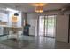 Bright kitchen featuring white cabinets, tile floors, stainless steel appliances and access to a sunroom at 2884 Mountbery Dr, Snellville, GA 30039