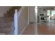 Open living room featuring beautiful hardwood floors and a staircase leading to the upper level at 2884 Mountbery Dr, Snellville, GA 30039