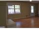 Spacious living room featuring hardwood floors, large windows, and a cozy atmosphere at 2884 Mountbery Dr, Snellville, GA 30039