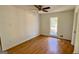 Simple bedroom with wood flooring and ceiling fan at 164 Glenloch Pkwy, Stockbridge, GA 30281