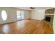 Living room with hardwood floors, fireplace, and access to deck at 164 Glenloch Pkwy, Stockbridge, GA 30281