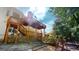 Large backyard with deck, patio area, and swing set, perfect for outdoor entertaining at 1461 Hada Ln, Lawrenceville, GA 30043