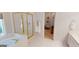 This bathroom has a bathtub, a shower behind glass, and a door leading to the closet at 1461 Hada Ln, Lawrenceville, GA 30043