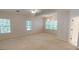 Bright bedroom with neutral tones, ceiling fan, and large windows provides lots of natural light at 1461 Hada Ln, Lawrenceville, GA 30043